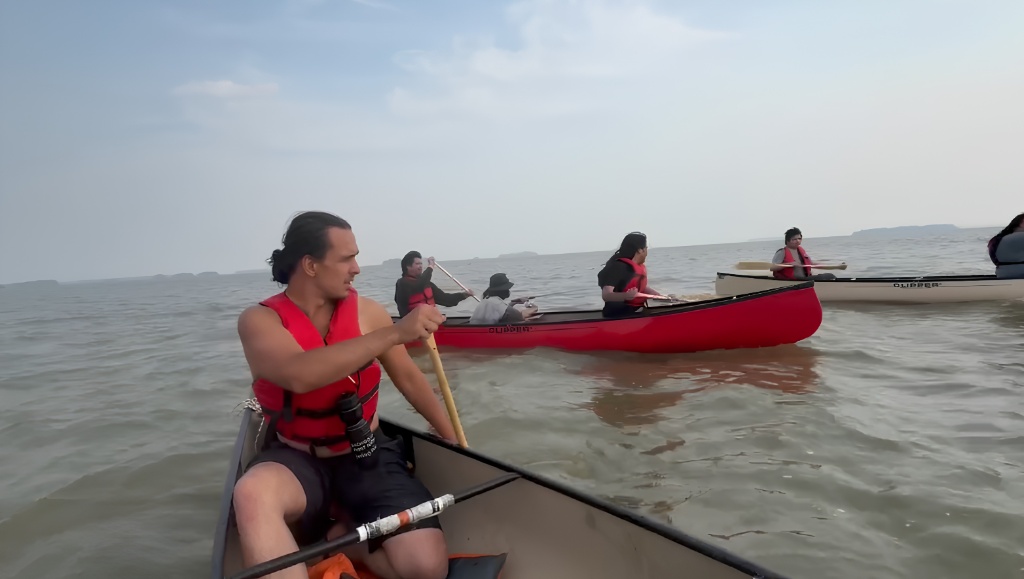 Harold Angeconeb canoeing with others