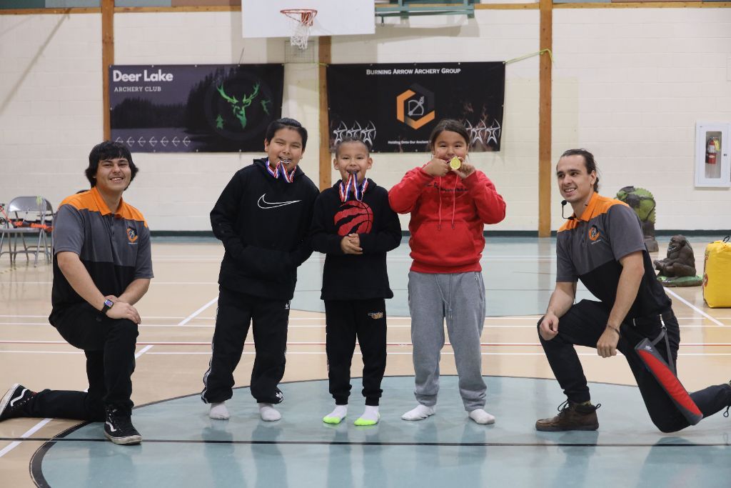 Youth archery line at Burning Arrow community event